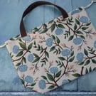 Large lined drawstring canvas project bag featuring blue peonies