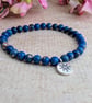 Blue sea sediment jasper stretch bracelet with North Star charm - Image 8