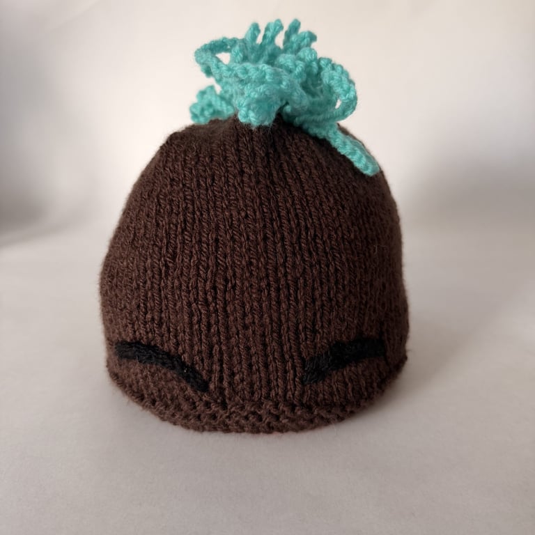 Children's hand knitted mohawk hat with eyebrows