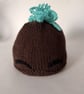 Children's hand knitted mohawk hat with eyebrows