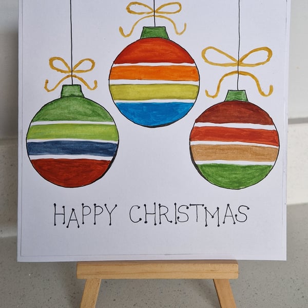 Three colourful striped Christmas baubles handpainted watercolours