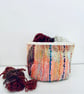 Colourful textile storage basket or pot plant holder