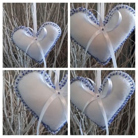 Heart hangers in white felt with silver sequins and blue beads.