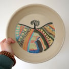 Hand thrown stoneware plate with painted country field scene