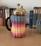 HAND KNITTED CAFETIERE COSY FOR A 1 LITRE POT IN MULTICOLOURED YARN