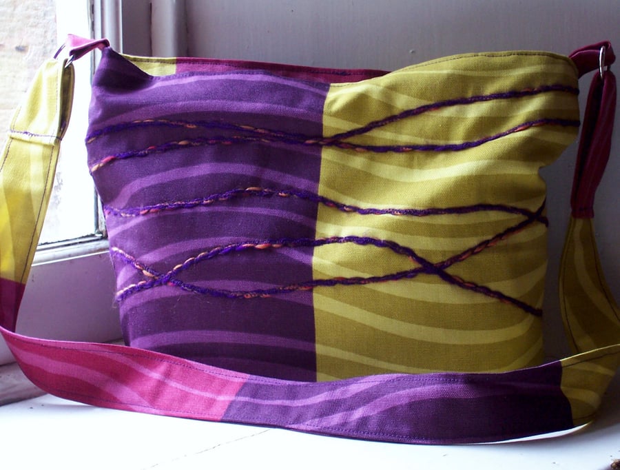 Soft textile zip fastening shoulder bag in purple, yellow and pink