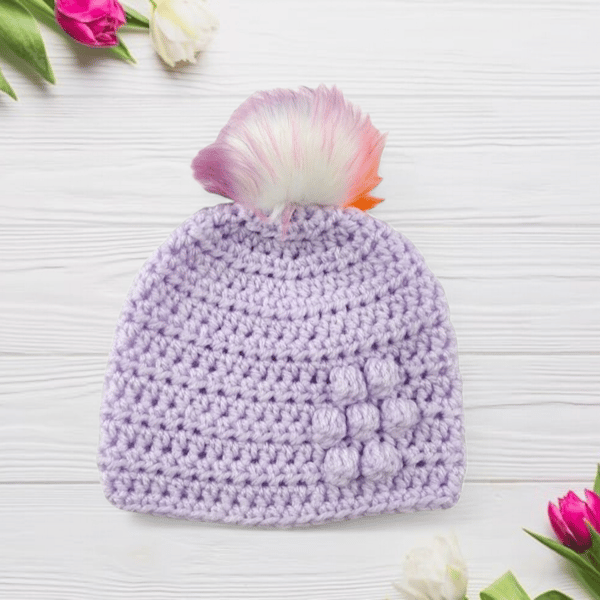 Lilac baby crocheted hat white faux fur pompom with orange purple & pink 