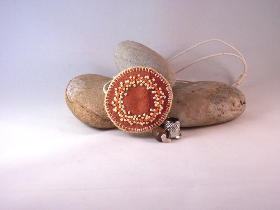 Fabric necklace with hand embroidered french knots