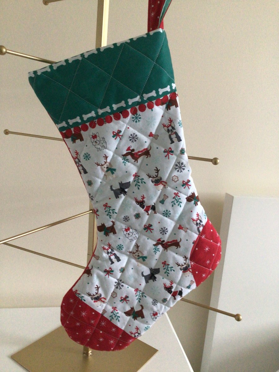 Quilted Christmas stocking. White dog designs.