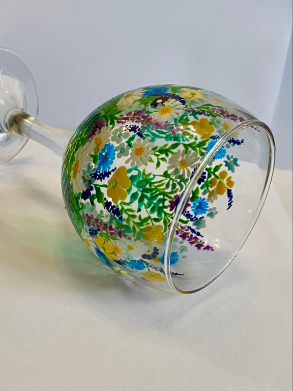 Hand painted floral design on wine glass
