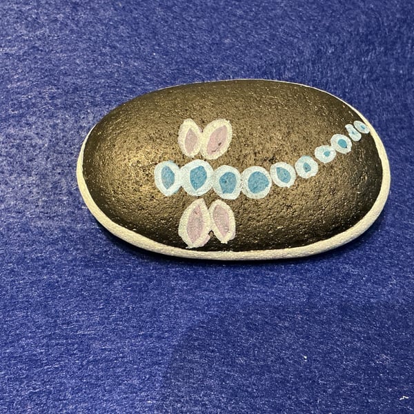 Hand painted pebble with dragonfly design.