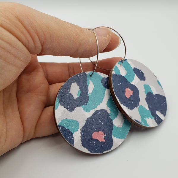 Animal print dangly hooped earrings in blue, turquoise, pink, white and grey