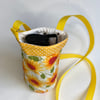 Water bottle carrier with pocket for phone. Sunflowers and bees
