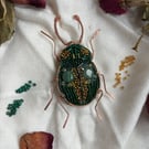 Charming copper with green and gold beaded brooch