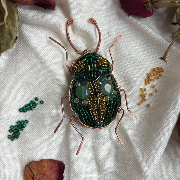 Charming copper with green and gold beaded brooch