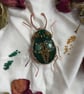 Charming copper with green and gold beaded brooch