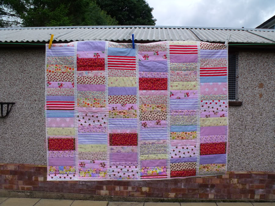 girls bright patchwork quilted bed throw, babies cot blanket or play mat