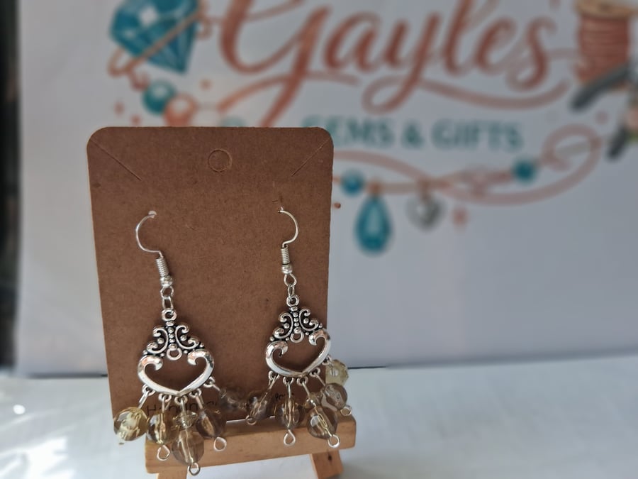 Green and silver dangle earrings