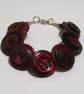 Cherry coloured button bracelet  	 - Image 1