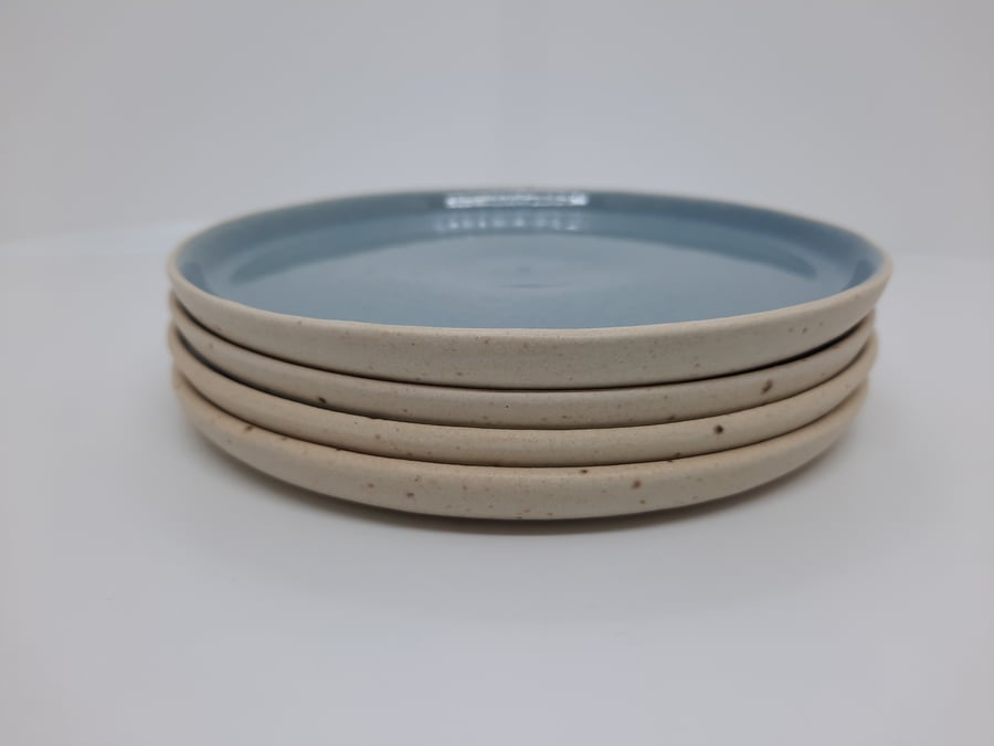  Four hand made ceramic blue and cream side plates,cheese plates