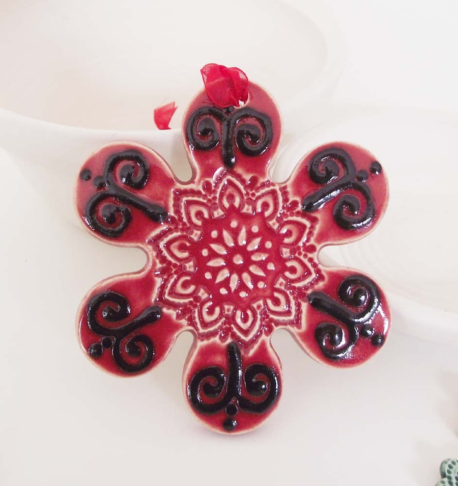 Sale Red ceramic flower decoration.