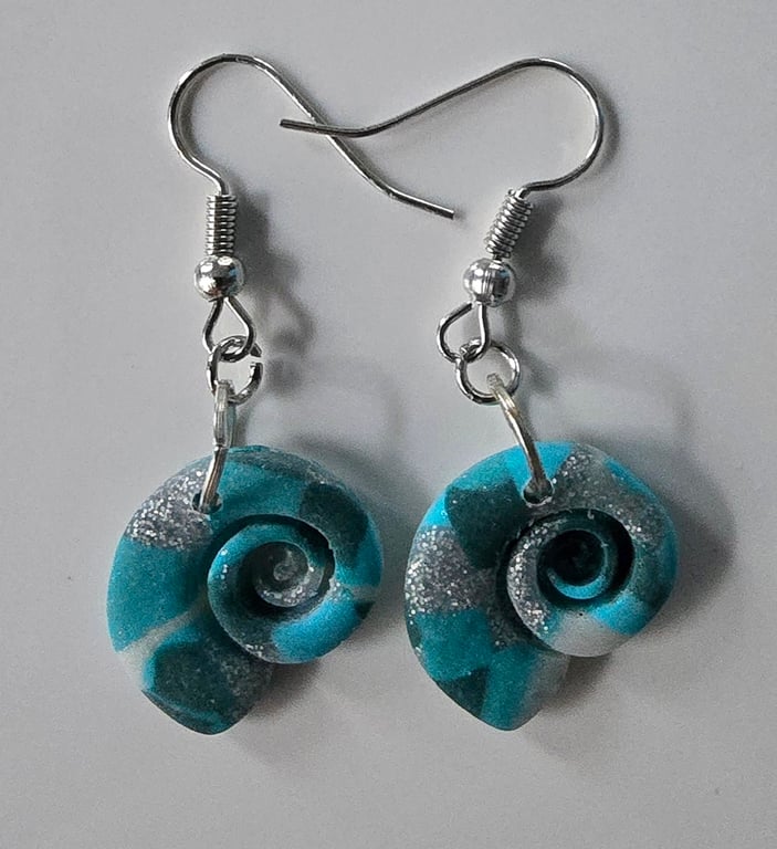 Sea shell style earrings on silver plated ear hooks