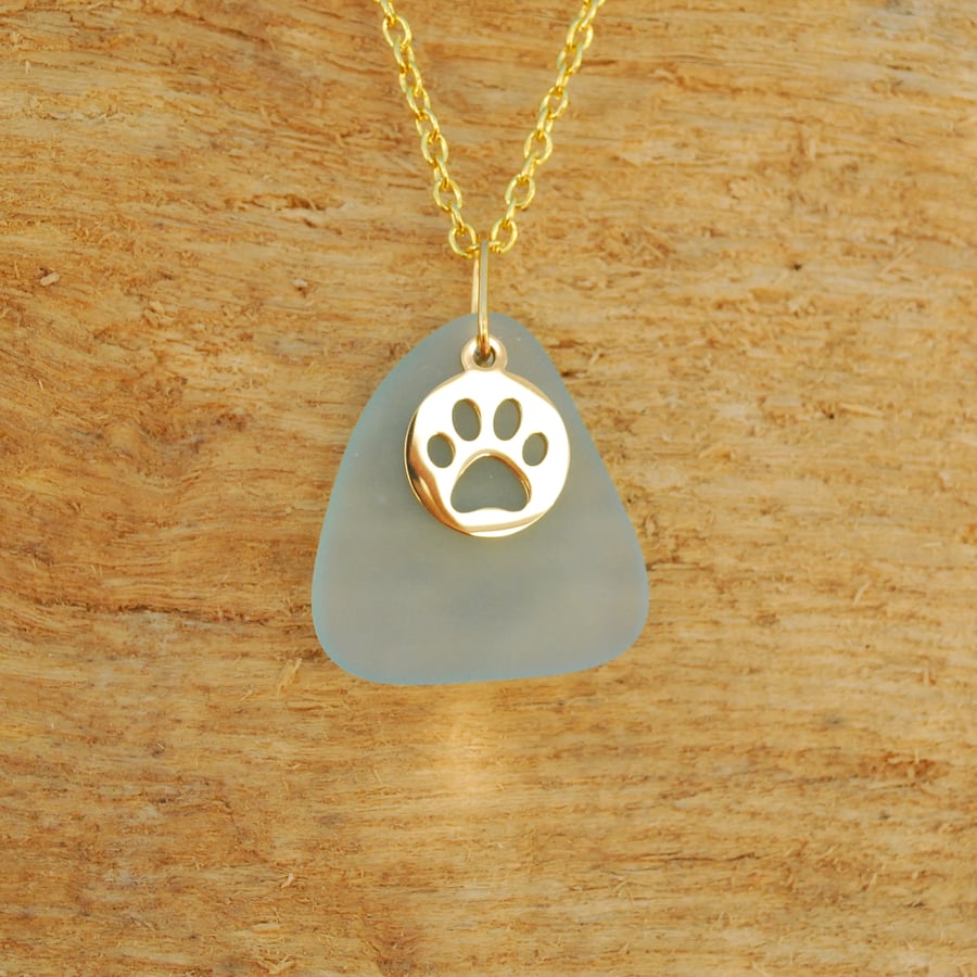 Aquamarine beach glass pendant with paw print charm