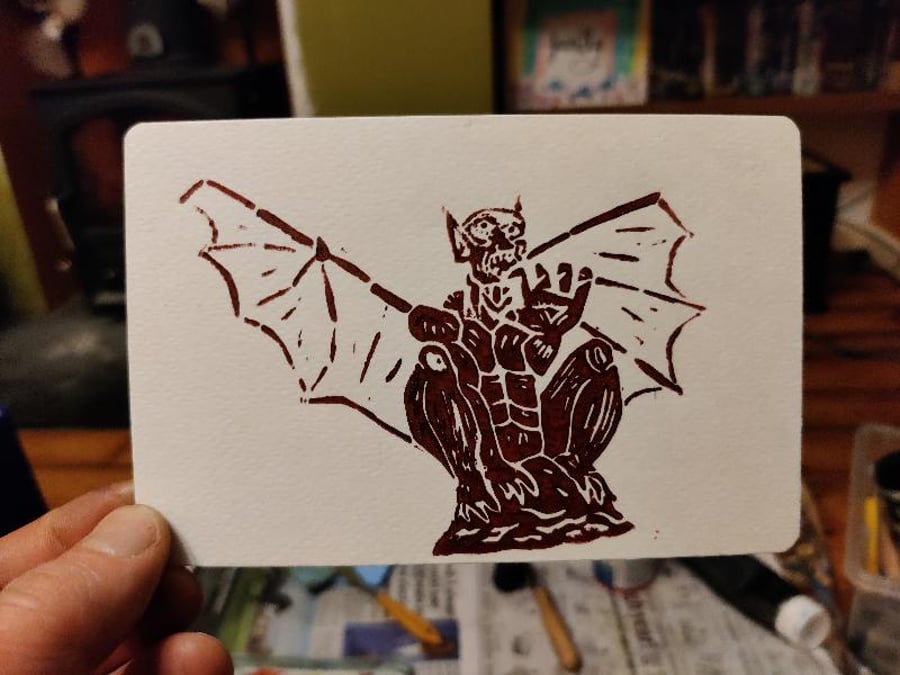 Original handcrafted Lino Print of a gargoyle perched and ready to fly.
