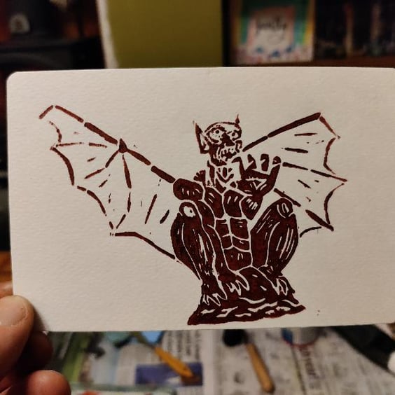 Original handcrafted Lino Print of a gargoyle perched and ready to fly.