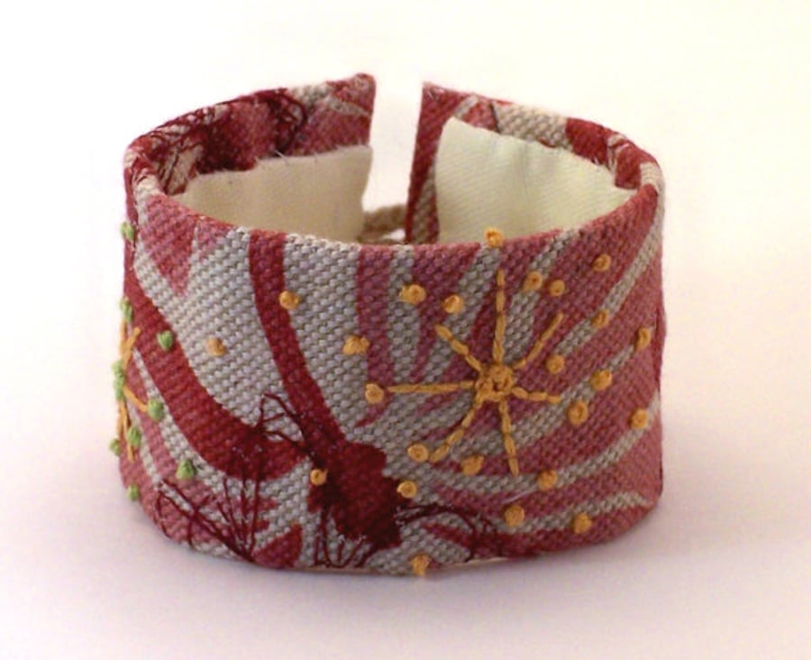 Printed linen hand embroidered cuff with yellow hand embroidery