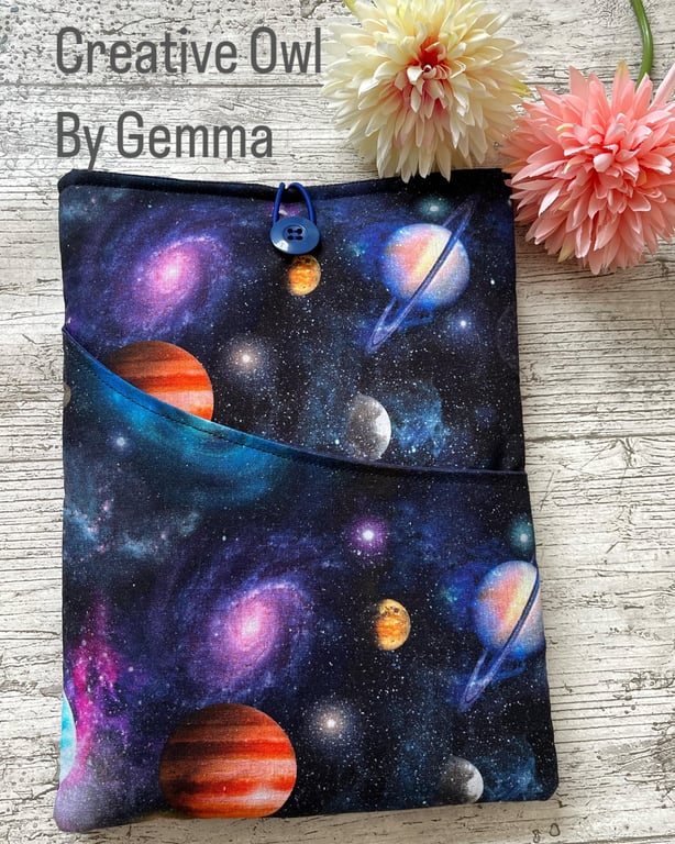 Fabric book sleeve with pocket for paperback books. Padded and fully lined. 