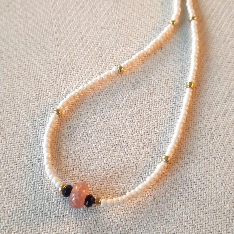 Glass and onyx beaded necklace, 16 to 18 inches.
