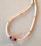 Glass and onyx beaded necklace, 16 to 18 inches.