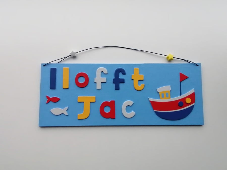 Welsh "Llofft" Boat themed personalised name plate with sky blue background.