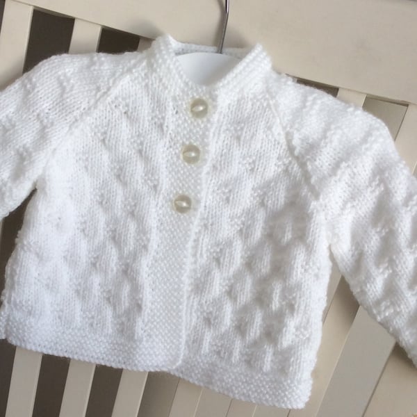 Hand knitted white baby cardigan