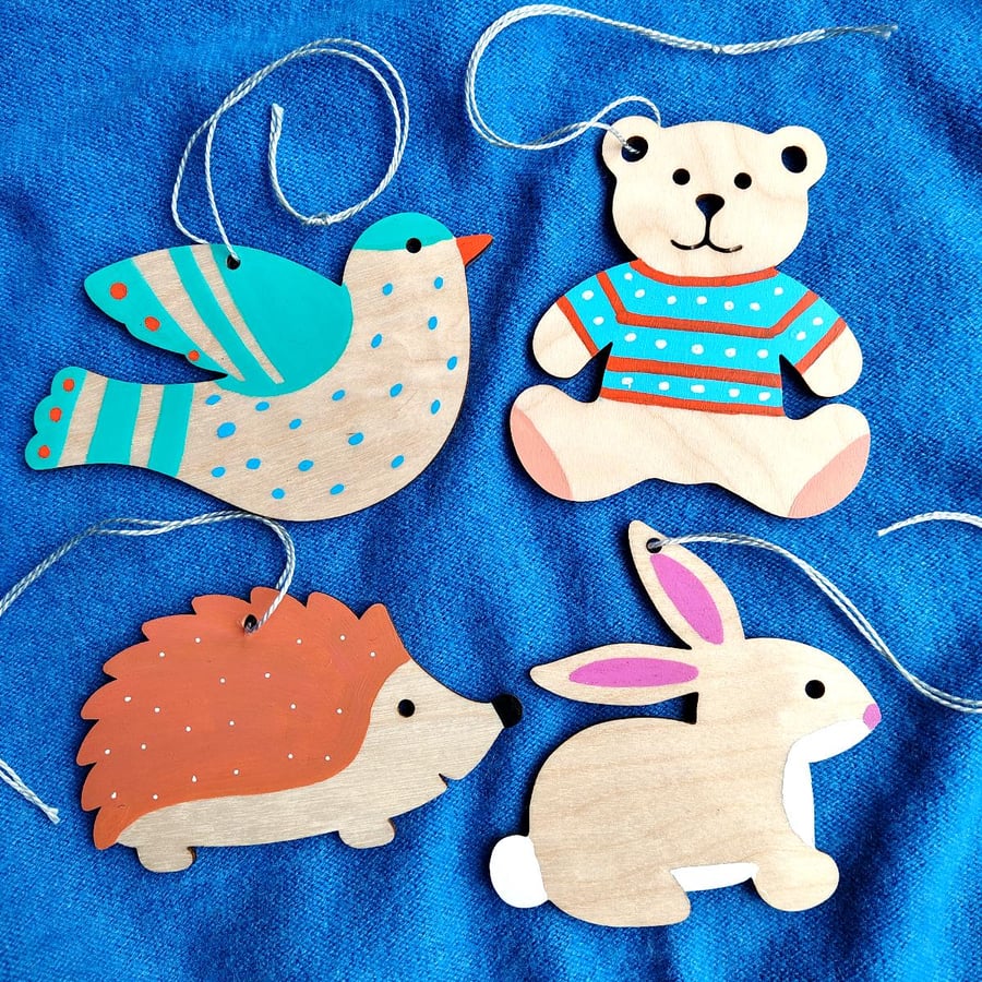 4 wooden hanging decorations teddy rabbit hedgehog and bird for nursery