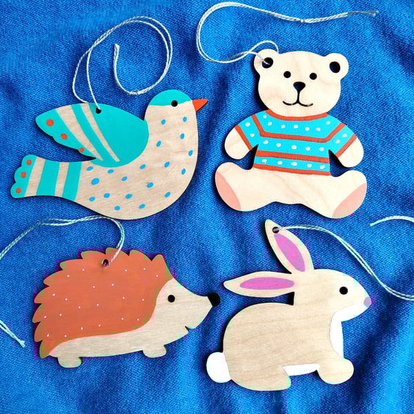 4 wooden hanging decorations teddy rabbit hedgehog and bird for nursery