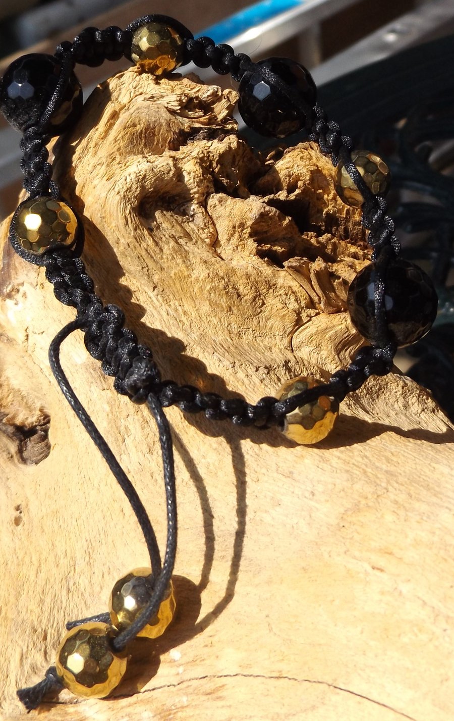 Black agate and gold plated pyrite macrame bracelet