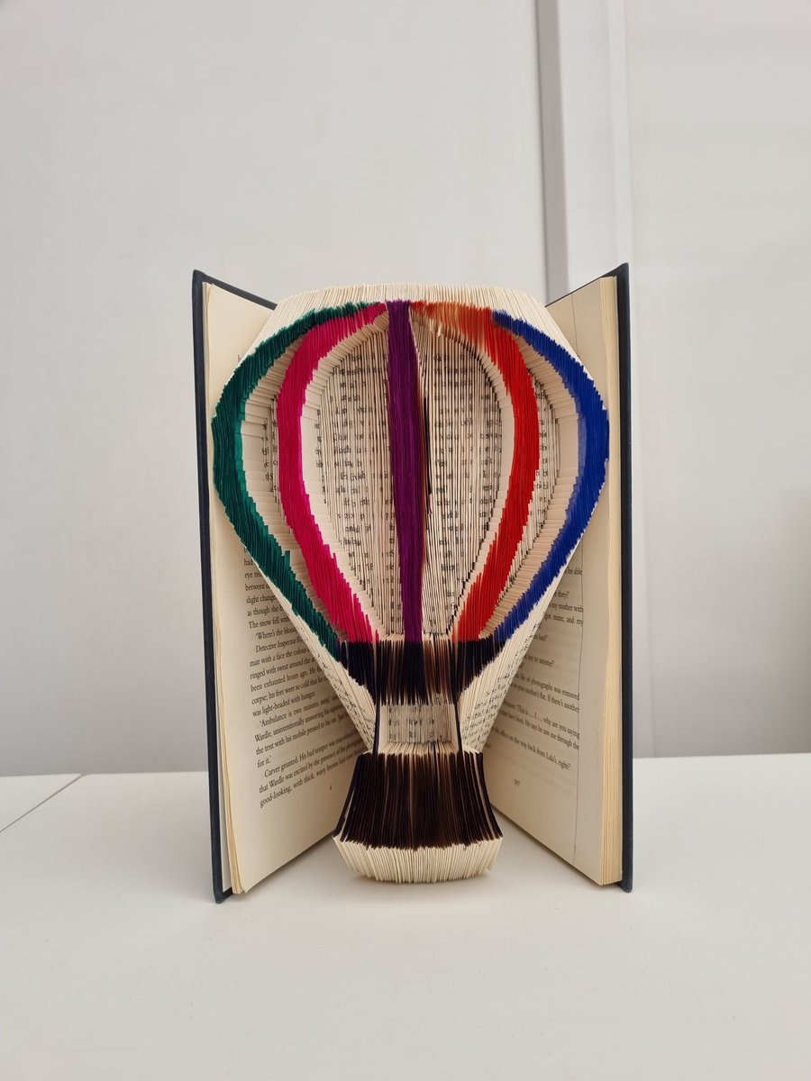 Colourful hot air balloon book art