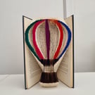 Colourful hot air balloon book art