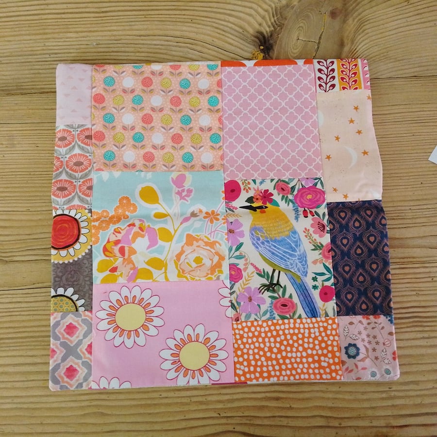 Image of Cushion cover in a peach abstract theme and envelope closure.