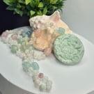 Knotted Beryl Necklace with Carved Calcite Hummingbird Pendant