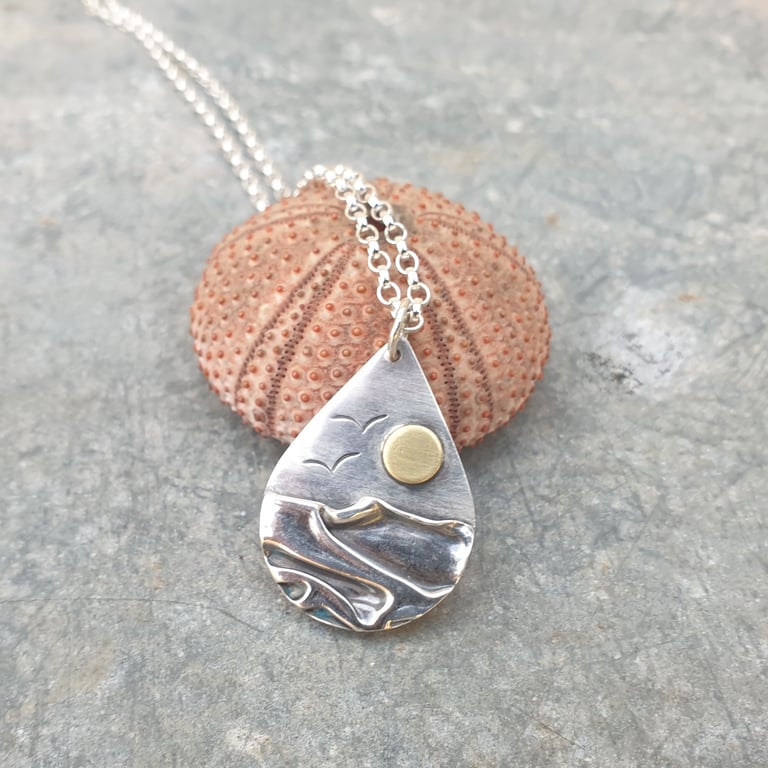 Silver beach, sea coast pendant, with brass sun and seagulls