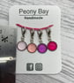 Set of 4 pink stitch markers - Image 1