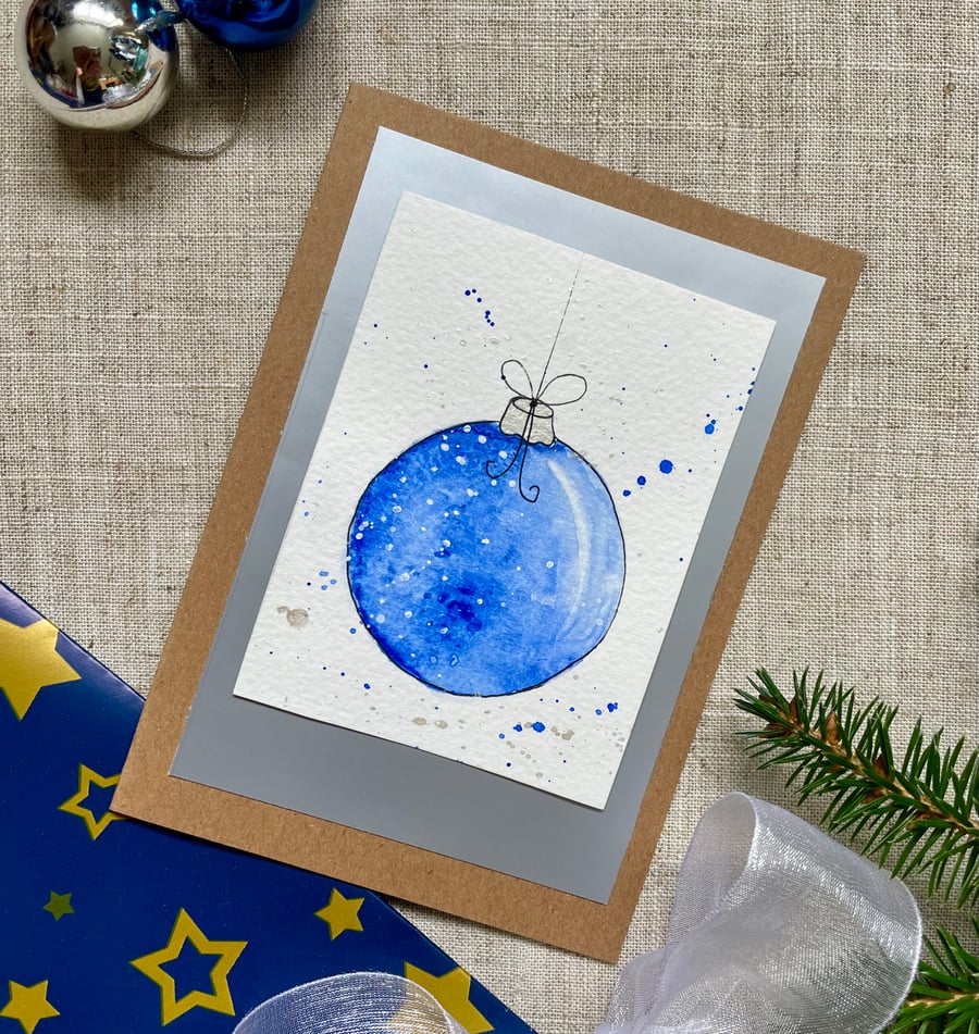 Christmas card, hand painted original of a single christmas bauble in blue.