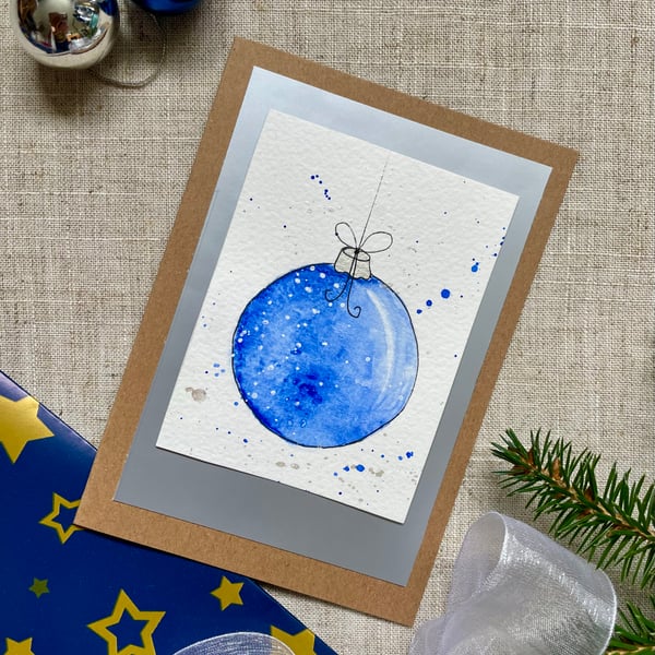 Christmas card, hand painted original of a single christmas bauble in blue.