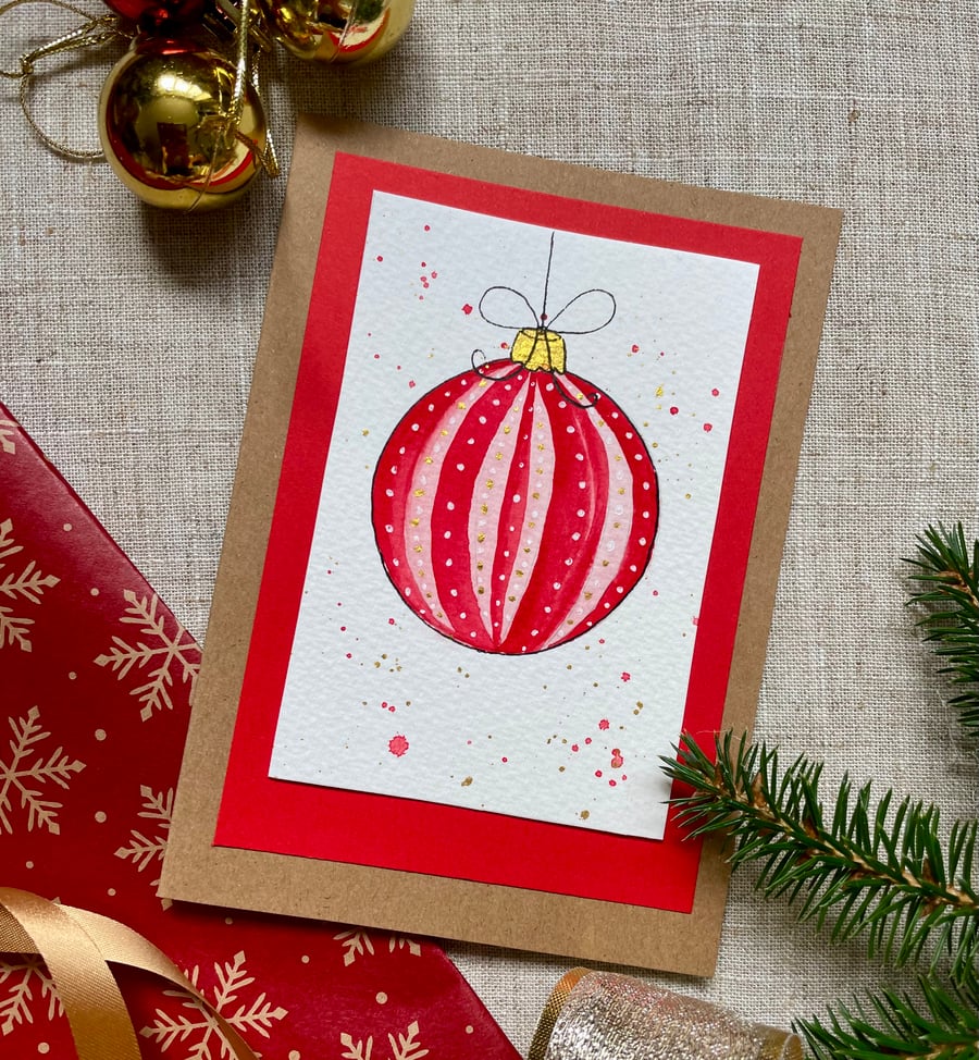 Christmas card, hand painted original of a single christmas bauble in red.
