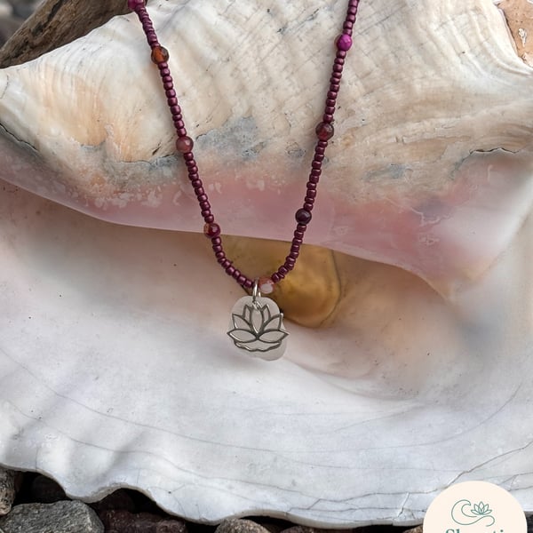 Seed beads and Agate in Burgundy with seaglass and Sterling Silver Lotus Charm