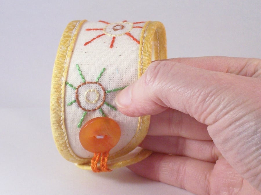 Hand embroidered textile jewellery for the wrist -  cuff in yellow and cream