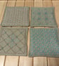 Set of four beige linen coasters with sashiko embroidery detail - Image 3